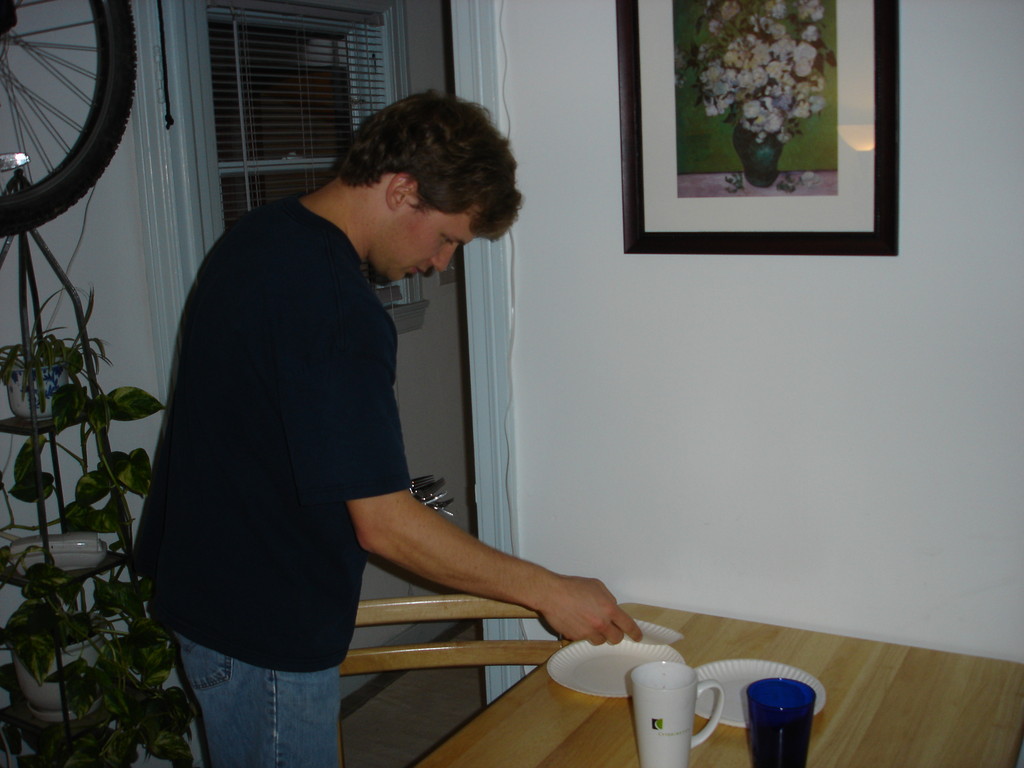 Mike setting the table for dinner