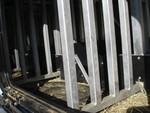 Facing the rear of the truck, the horses heads are oriented towards the left, where you can open a window, and put in their feed.