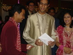Sanjeev presenting our group gift (a Fry's gift certificate) to Nitin and his new wife, Aditi