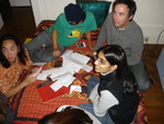 Hiroshi, Jean, Todd, and Anjali reading the secret time capsule questionnaires before their time...