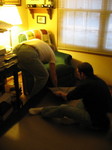 Dad and I fighting to get the carpet under the chair