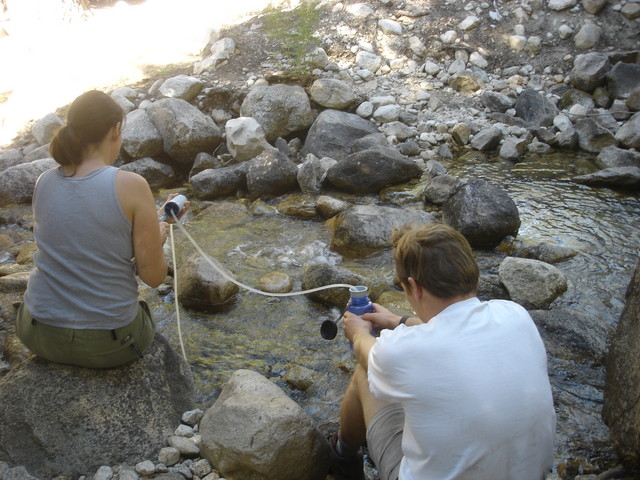 Teamwork: Mike and Sheila filtering some water for drinking.