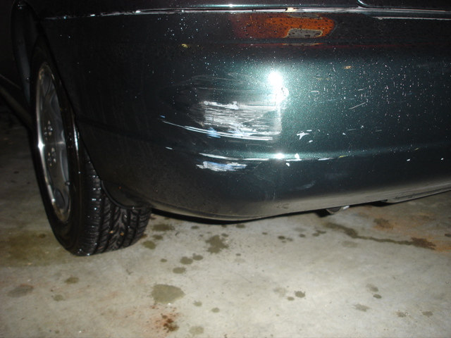 The nasty scrape on my left bumper, post accident