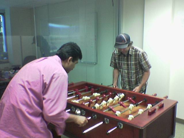 Raj and Matt playing foosball