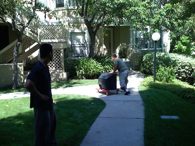 The movers using a rolling cart with the TV - brilliant!