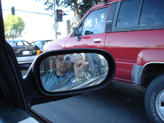 me, reflected in Mike's side mirror