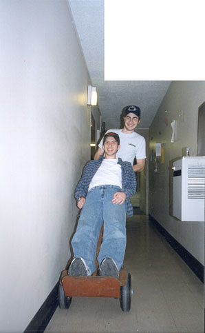 Steve pushing Chris on my dad's handtruck