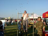 Laura, trying to hold on for 60 seconds, in order to win a hat.