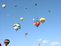 A shot of the skyline, filled with balloons.