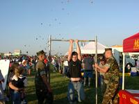 Mark, trying to do 18 pull-ups in order to win a hat.